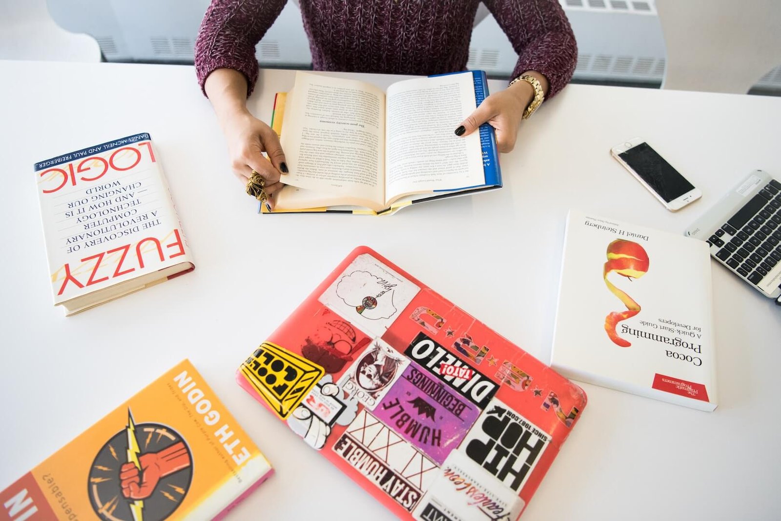 assorted-title books on table